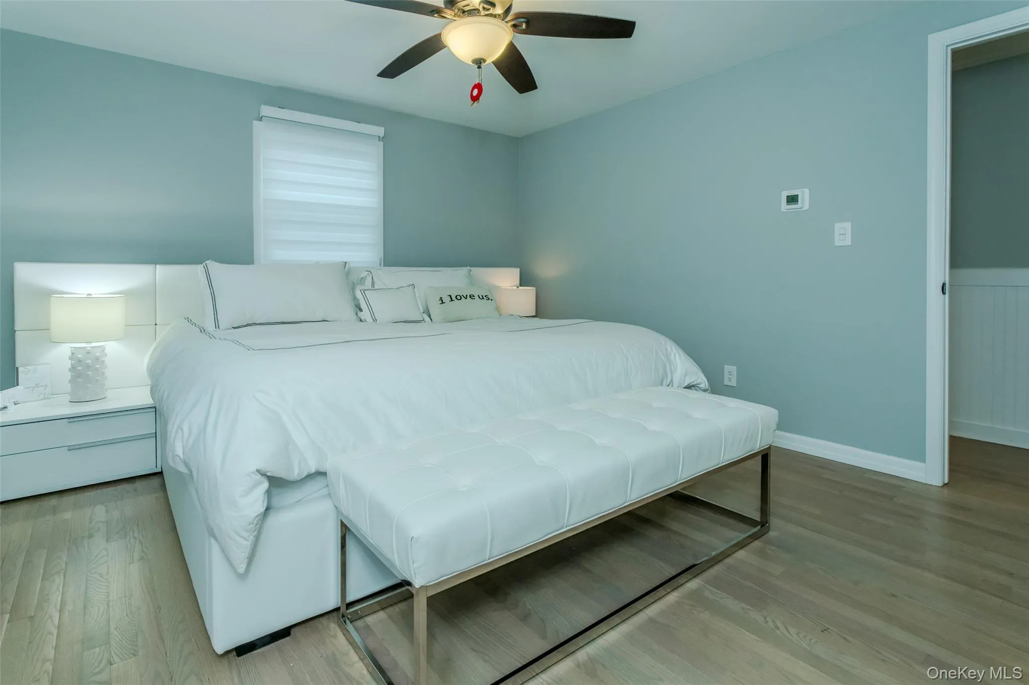 Bedroom with light hardwood / wood-style flooring and ceiling fan Bedroom with light hardwood / wood-style flooring and ceiling fan