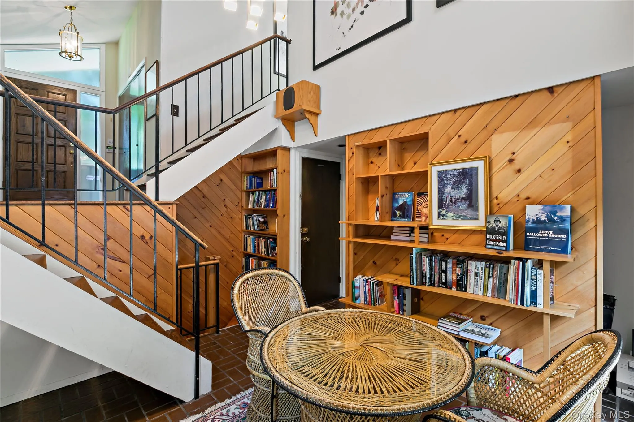 Library with steps up to Main Level. Library with steps up to Main Level.