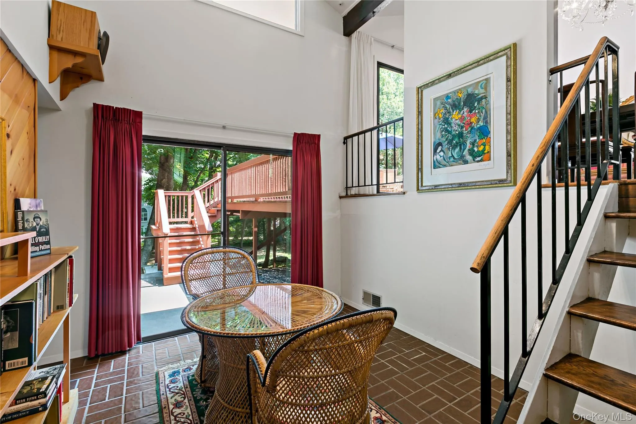 Sun-filled Library with sliding glass doors to stone patio. Sun-filled Library with sliding glass doors to stone patio.