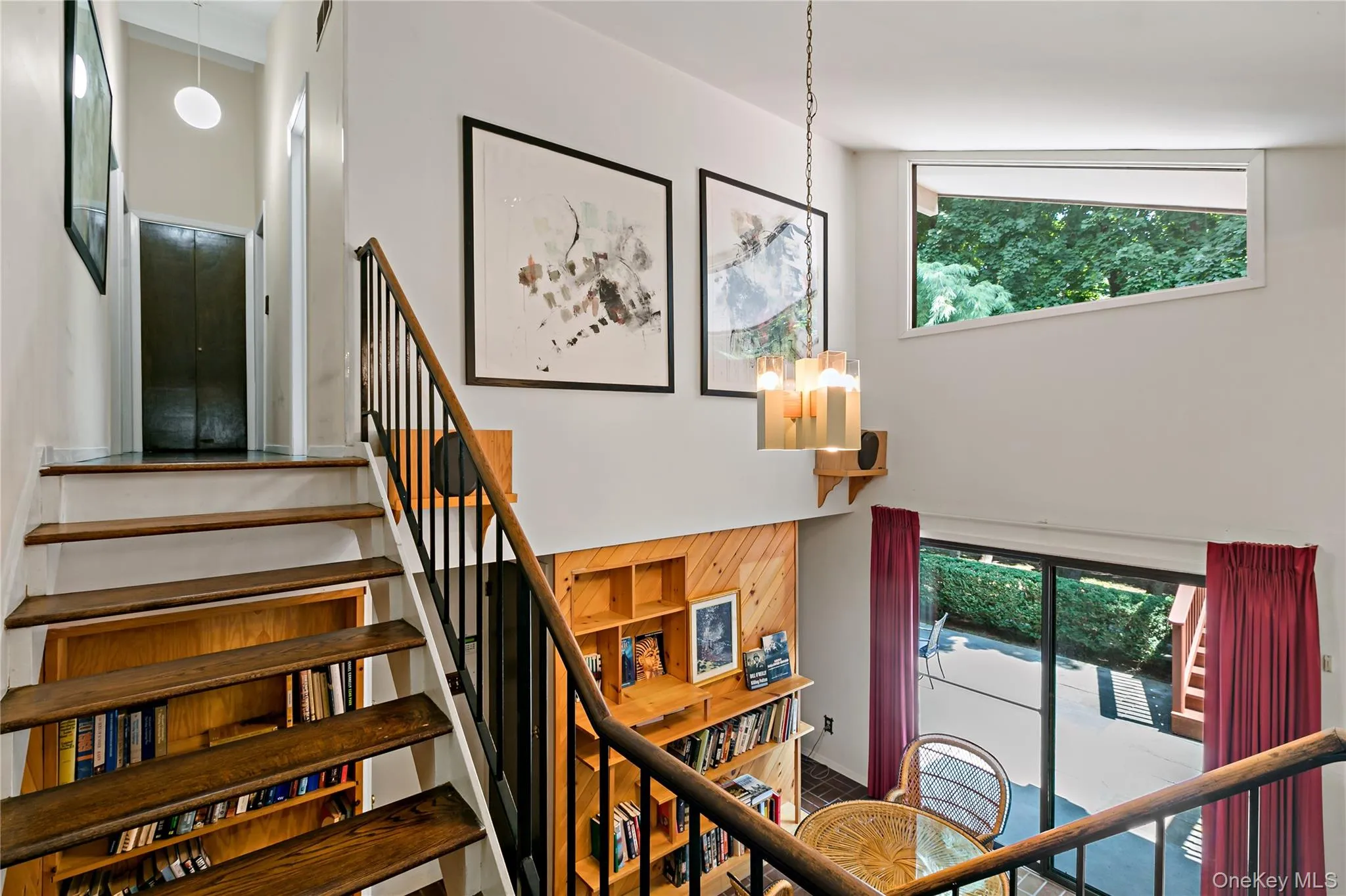 View of steps to Bedroom level and view of Library just a few steps down. View of steps to Bedroom level and view of Library just a few steps down.