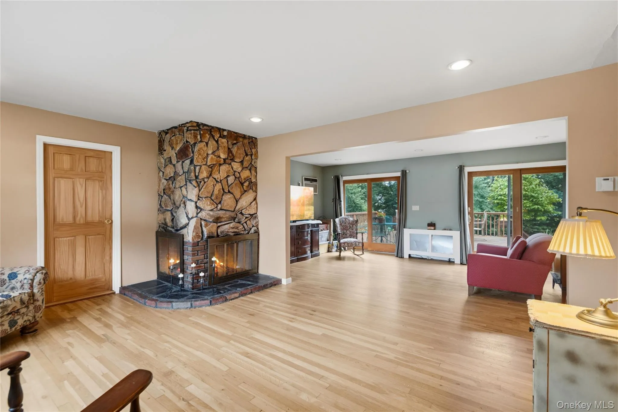 Living Room with Woodburning Fireplace and Entry into Room for Office-Playroom-Gym-4th Bedroom Living Room with Woodburning Fireplace and Entry into Room for Office-Playroom-Gym-4th Bedroom