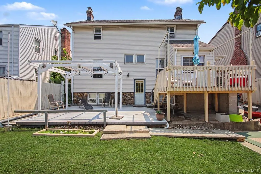 Expansive backyard oasis featuring a manicured lawn Expansive backyard oasis featuring a manicured lawn