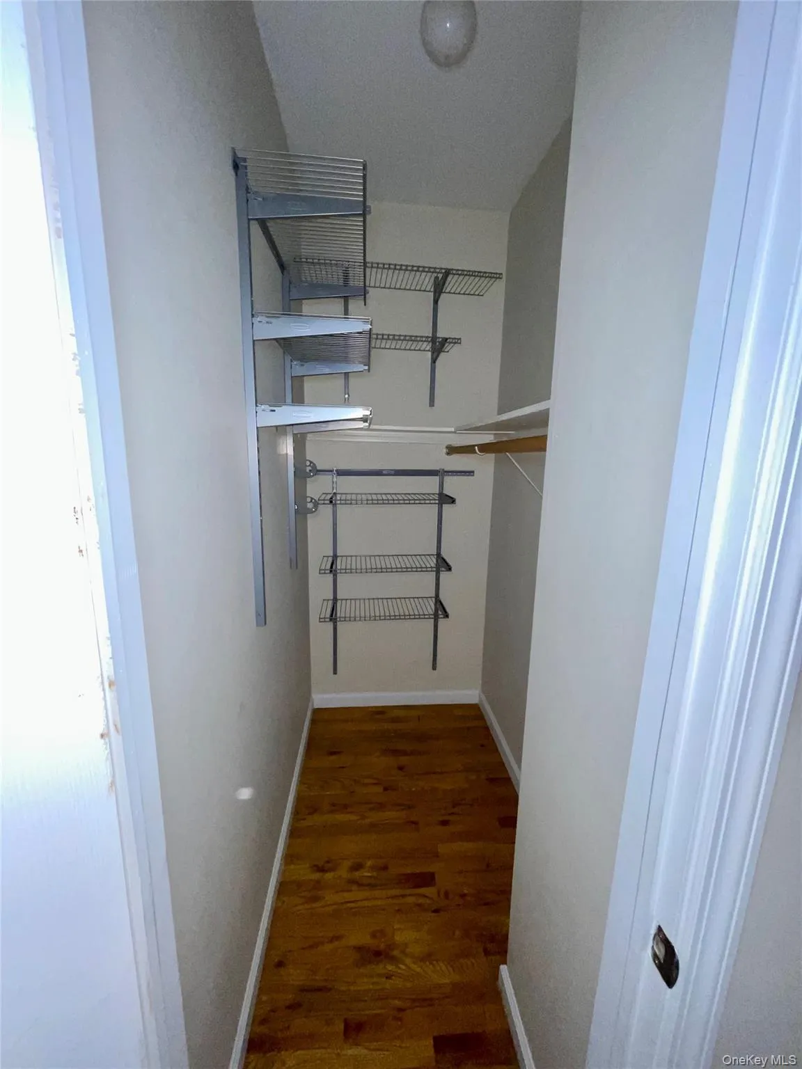 Spacious closet featuring wood finished floors Spacious closet featuring wood finished floors