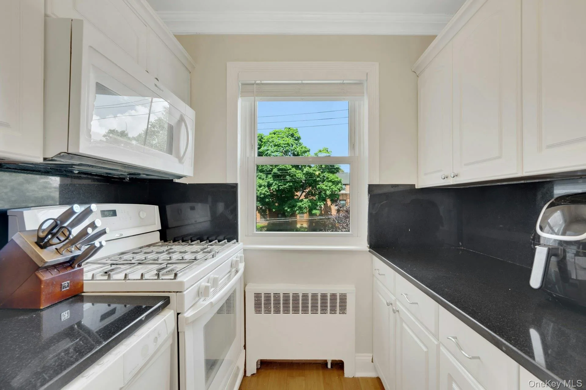 Kitchen showing sleek granite counters Kitchen showing sleek granite counters