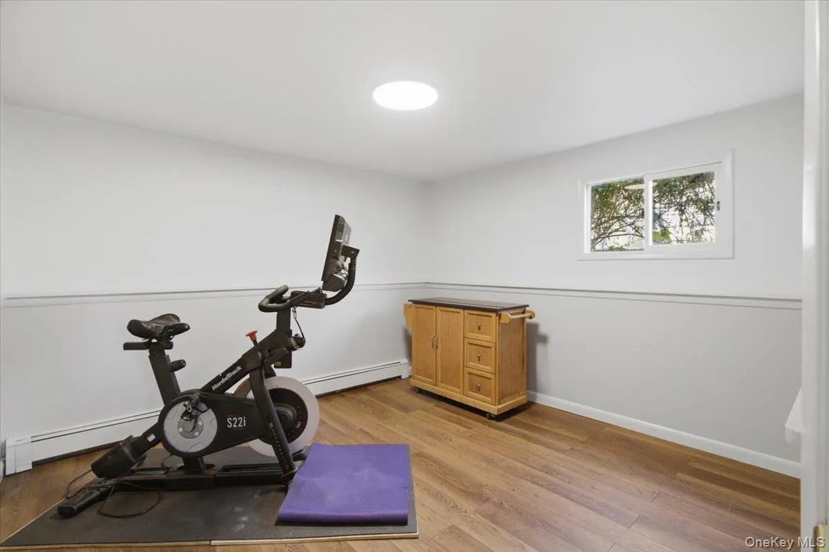 Lower level bedroom room also used as a home gym. Lower level bedroom room also used as a home gym.
