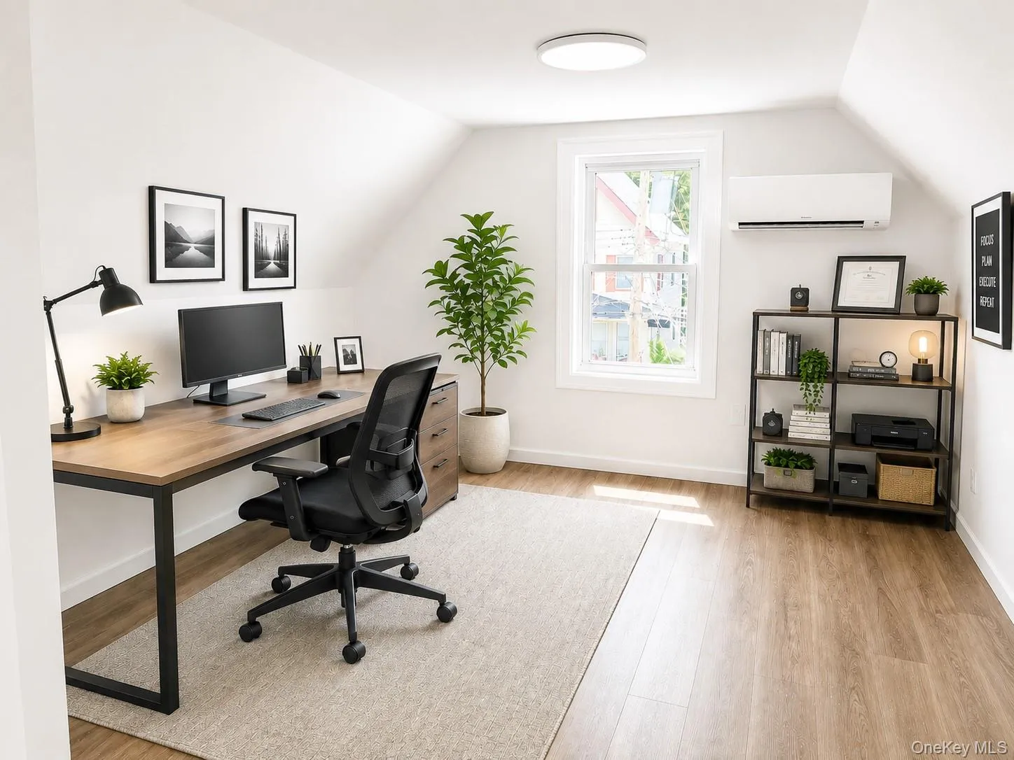 Versatile room featuring wood-finish flooring, a double-hung window, and sloped ceiling accents Versatile room featuring wood-finish flooring, a double-hung window, and sloped ceiling accents