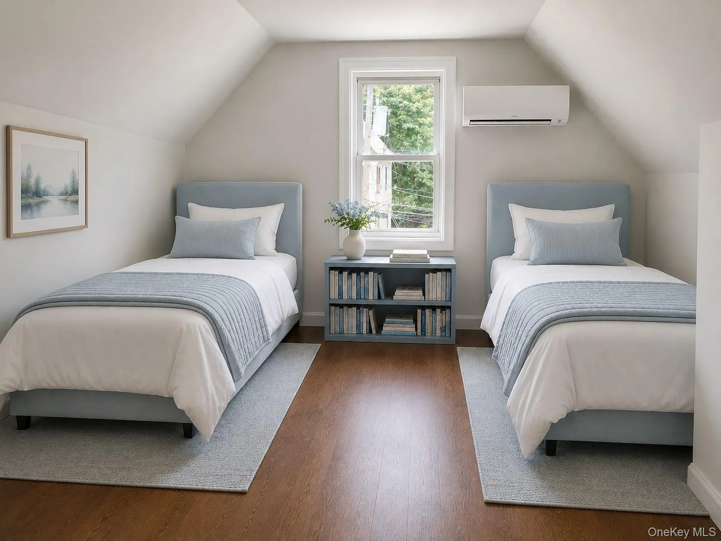 Versatile room featuring pitched ceilings, wood-finish flooring, and a double-hung window Versatile room featuring pitched ceilings, wood-finish flooring, and a double-hung window