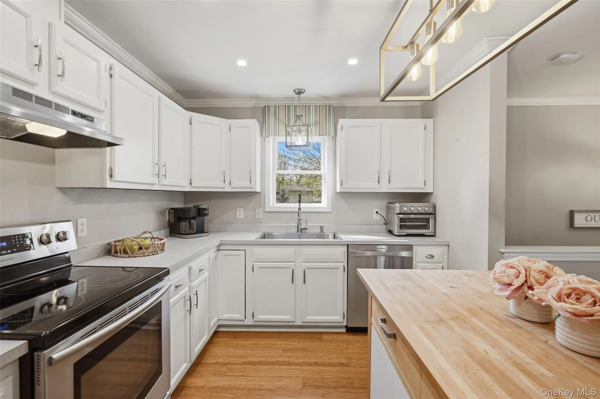 White cabinetry with brushed nickel hardware White cabinetry with brushed nickel hardware