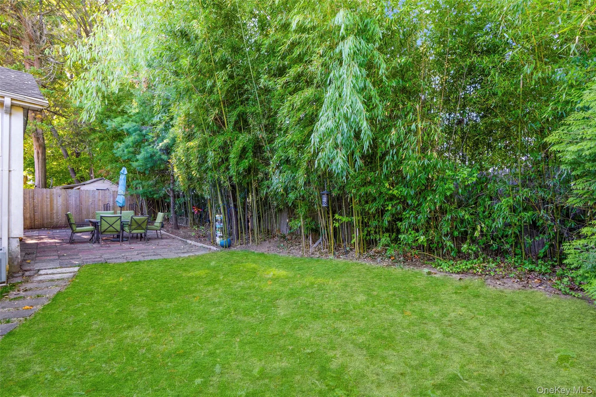 Inviting private backyard, perfect for relaxing outdoors, entertaining friends or simply enjoying your morning coffee surrounded by greenery. Inviting private backyard, perfect for relaxing outdoors, entertaining friends or simply enjoying your morning coffee surrounded by greenery.