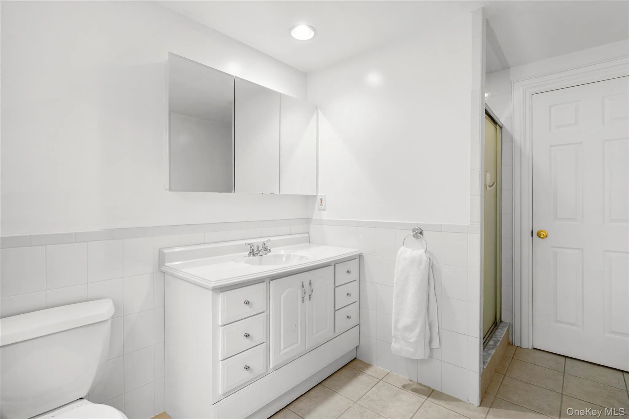 Another view of the top floor full bathroom with a shower stall. Another view of the top floor full bathroom with a shower stall.