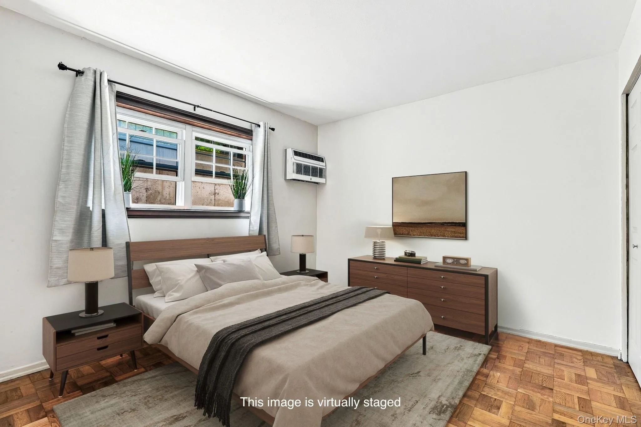 Bedroom with parquet floors, there is a wall of closets in this room. Bedroom with parquet floors, there is a wall of closets in this room.