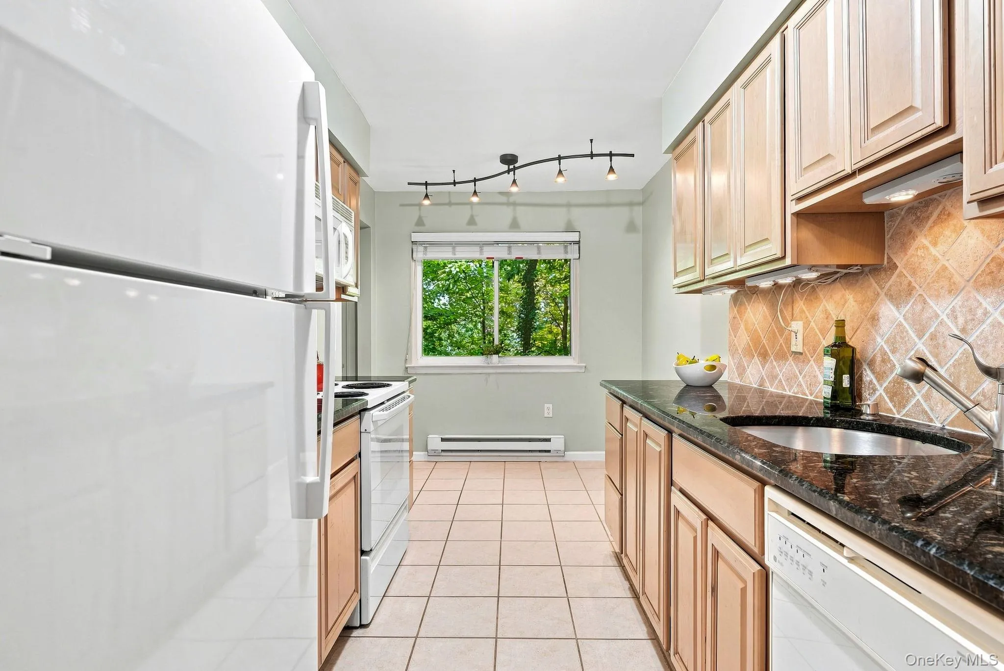 Galley kitchen, with under cabinet lighting. Galley kitchen, with under cabinet lighting.