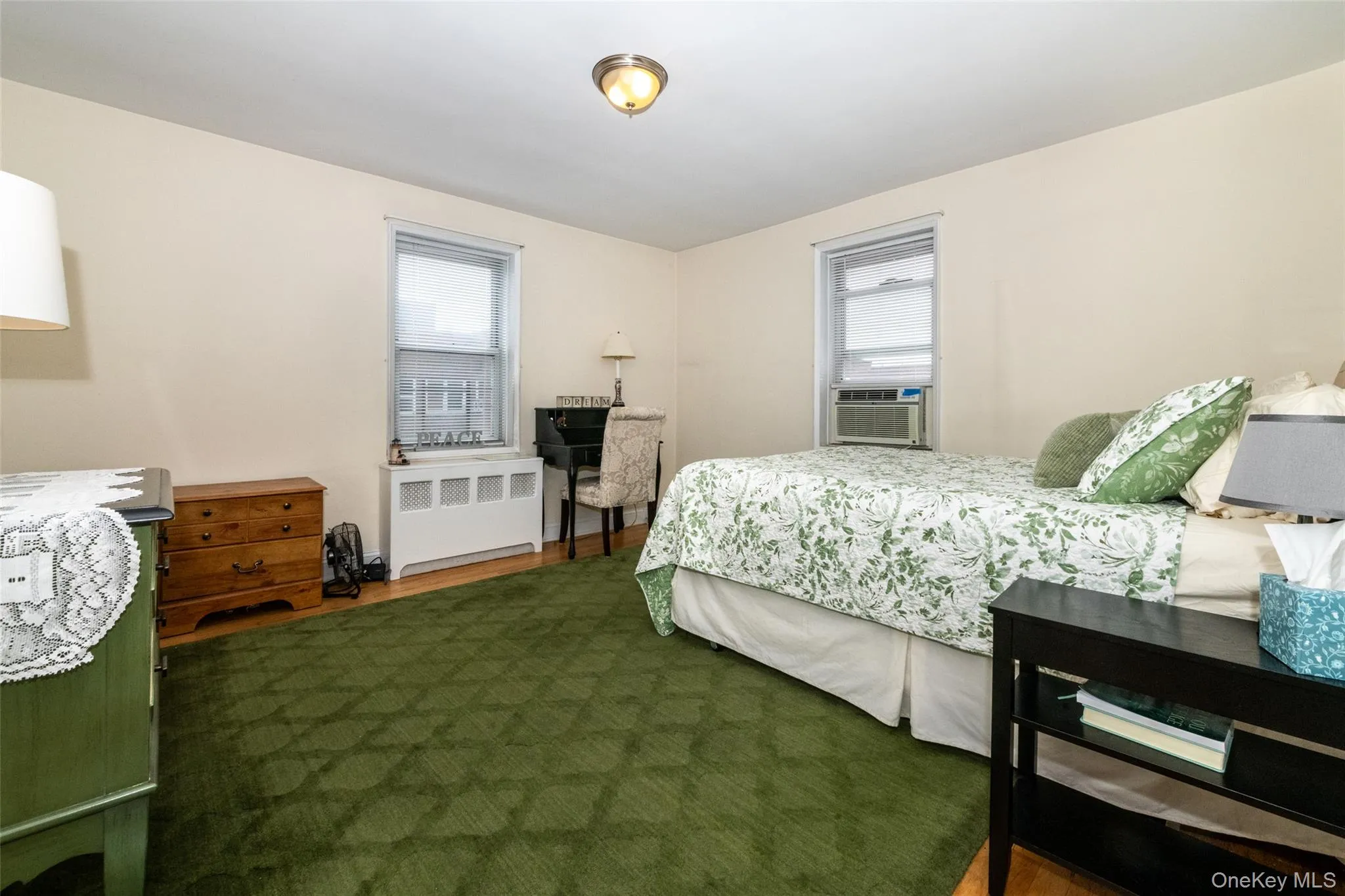 Large bedroom with 2 windows and water views Large bedroom with 2 windows and water views