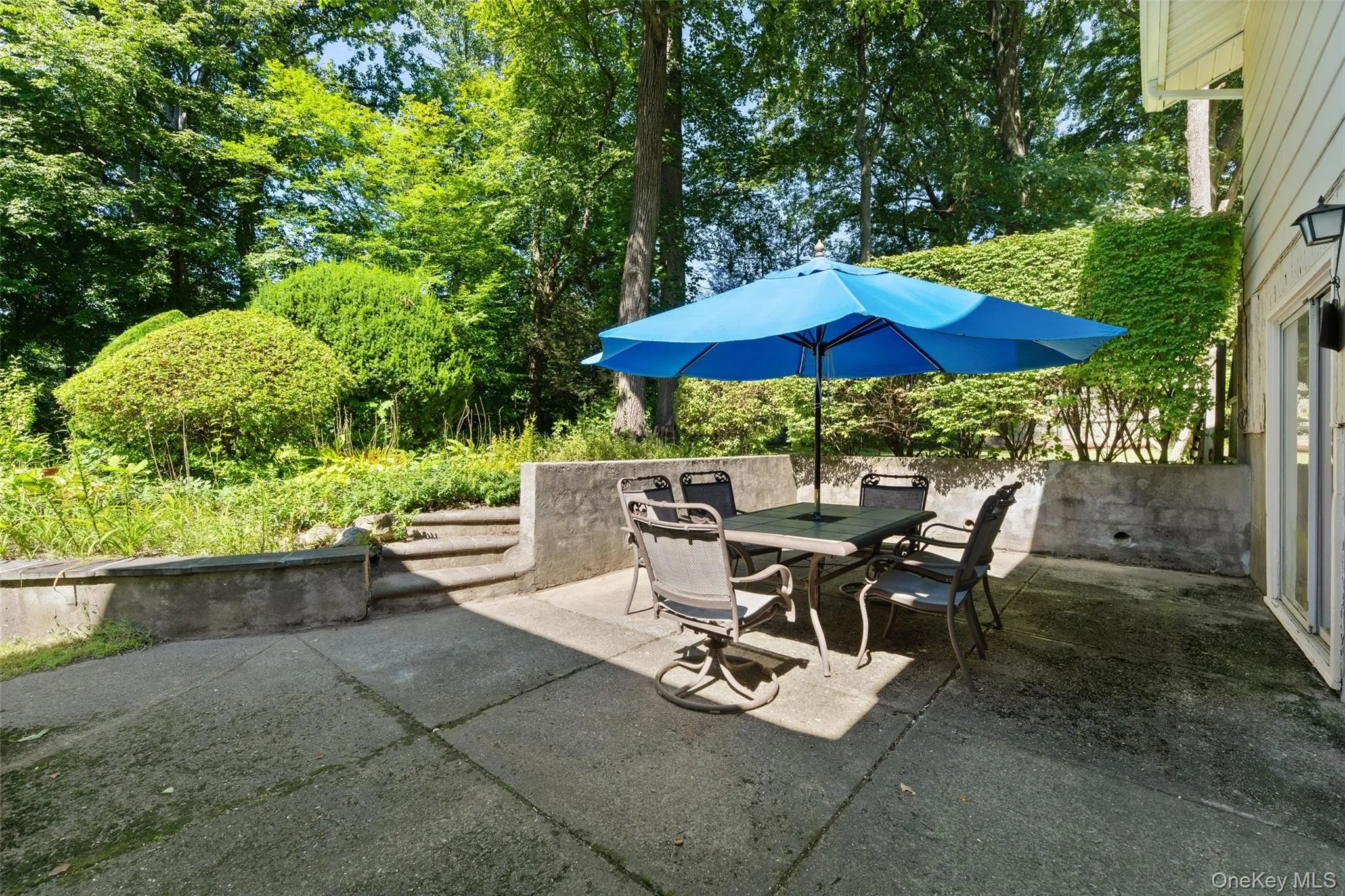 Outdoor Patio off of the basement with outdoor access to upstairs Outdoor Patio off of the basement with outdoor access to upstairs