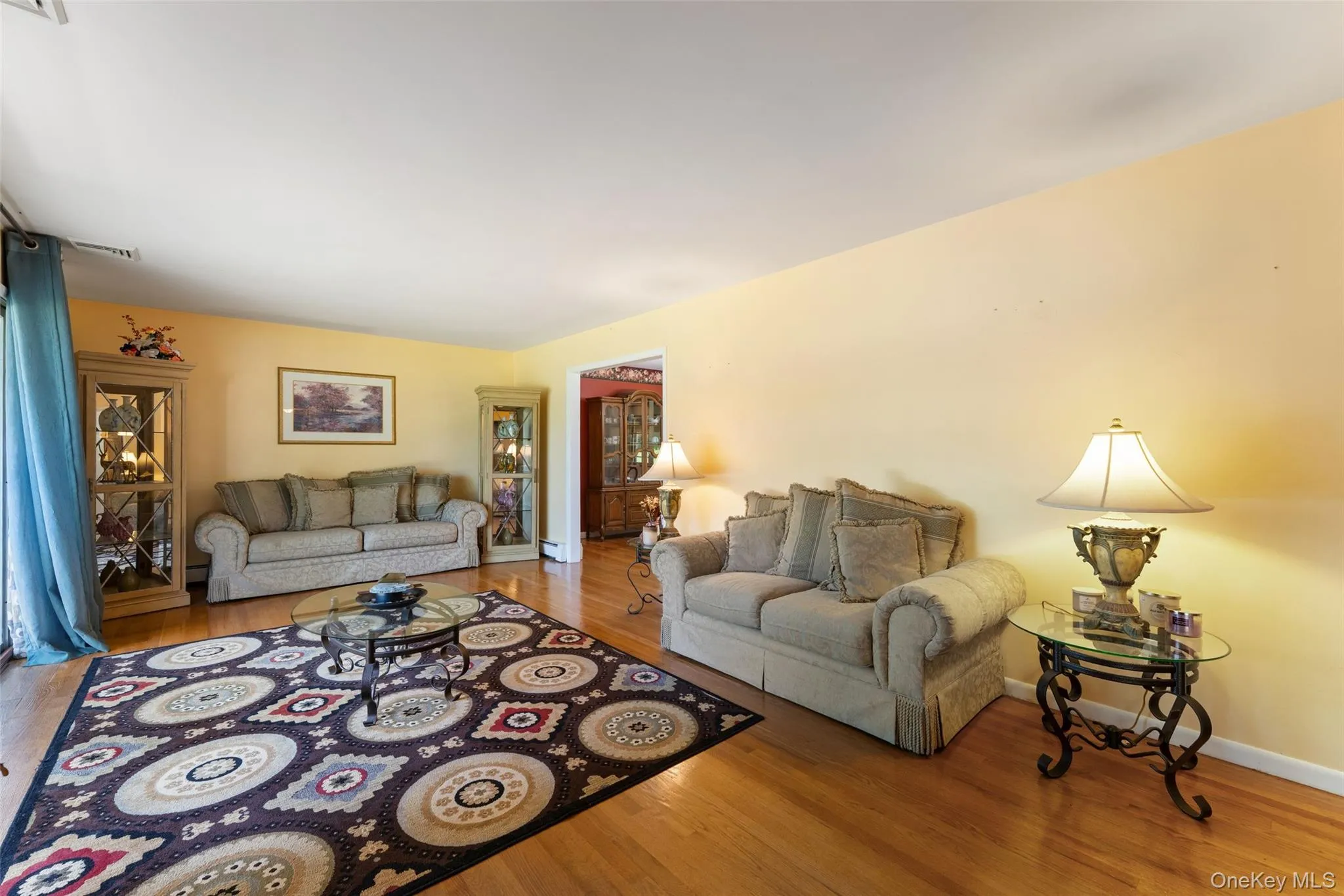 Living room with access to both dining and kitchen Living room with access to both dining and kitchen