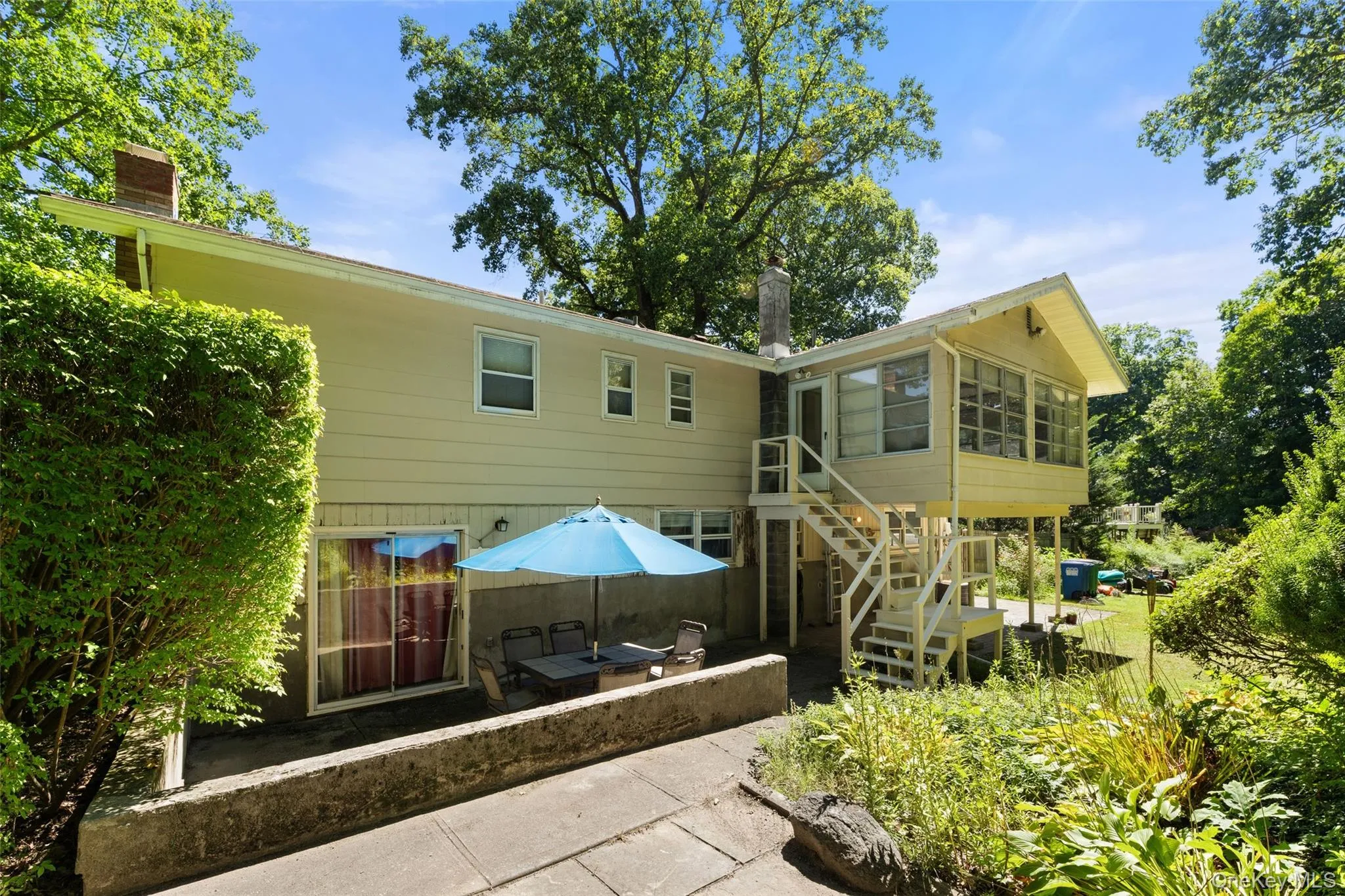 Backyard patio, sunroom and garden Backyard patio, sunroom and garden
