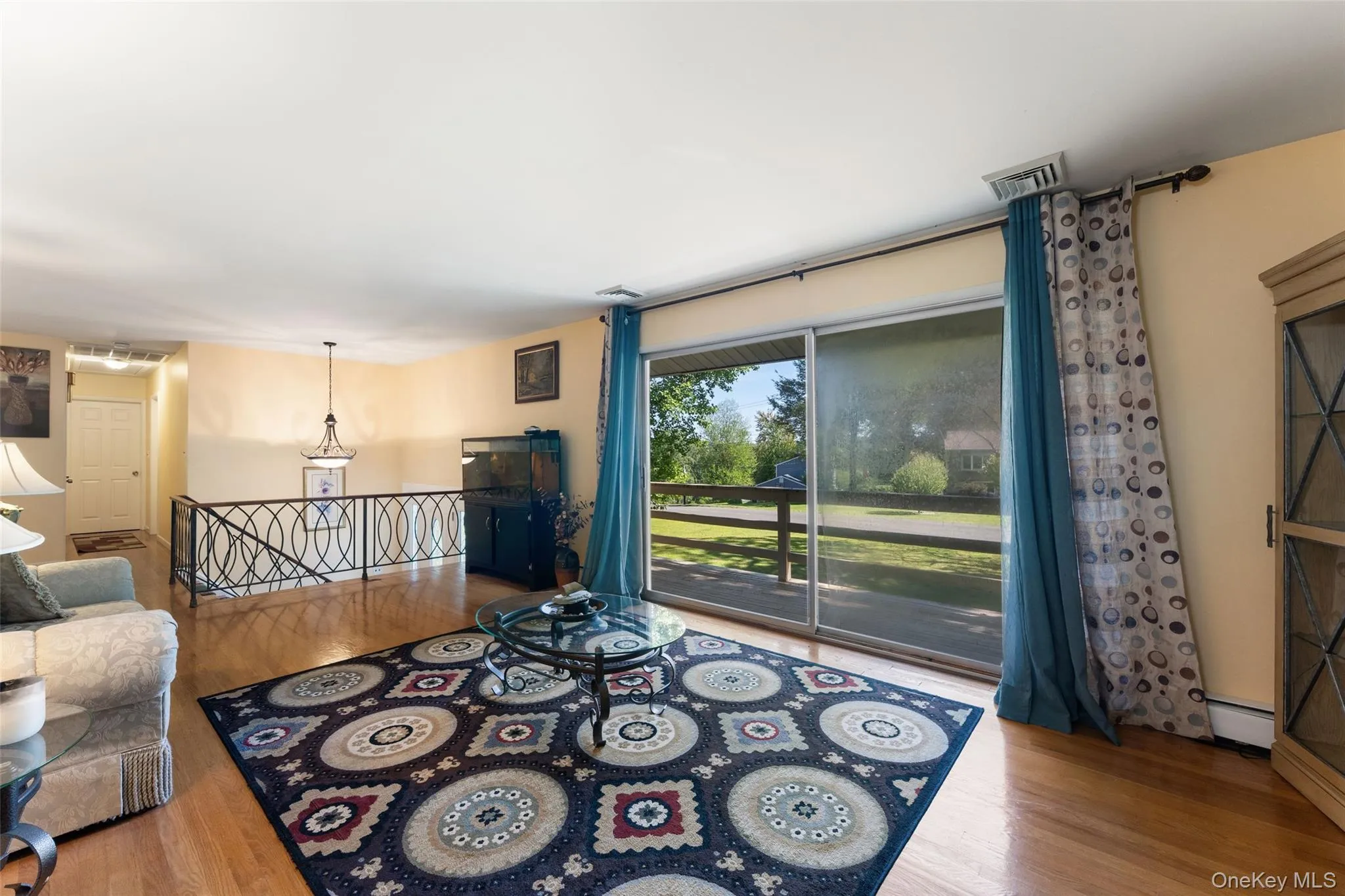 Sliding Glass doors off living room onto outdoor deck Sliding Glass doors off living room onto outdoor deck