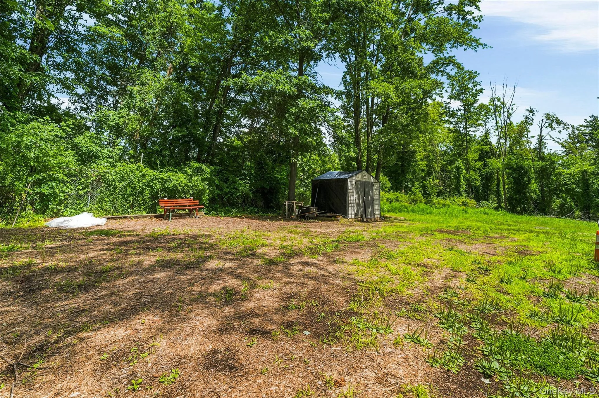 Flat backyard for versatile use with shed Flat backyard for versatile use with shed