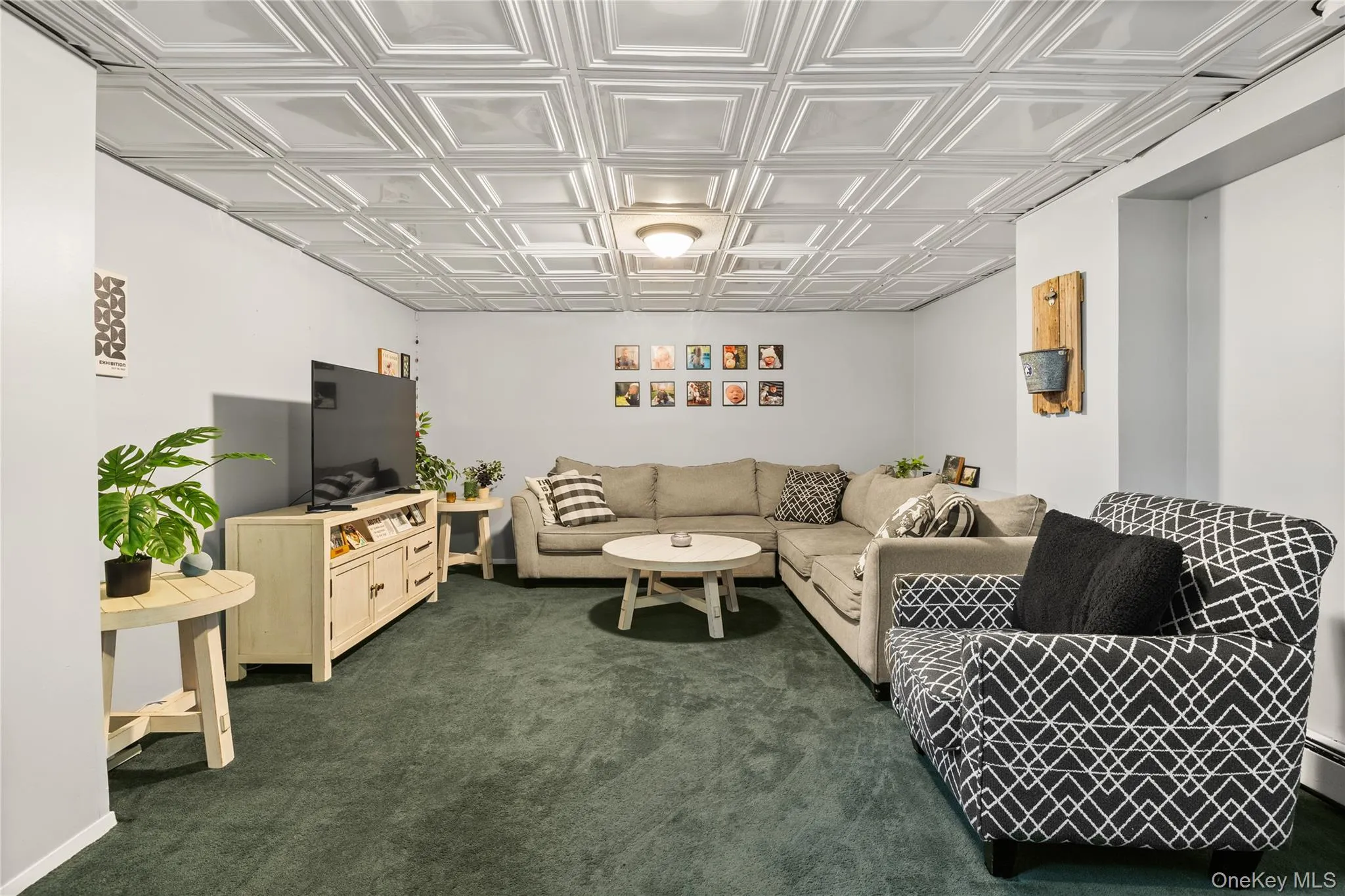 Recessed ceiling with white decorative panels and a central flush-mount light fixture Recessed ceiling with white decorative panels and a central flush-mount light fixture