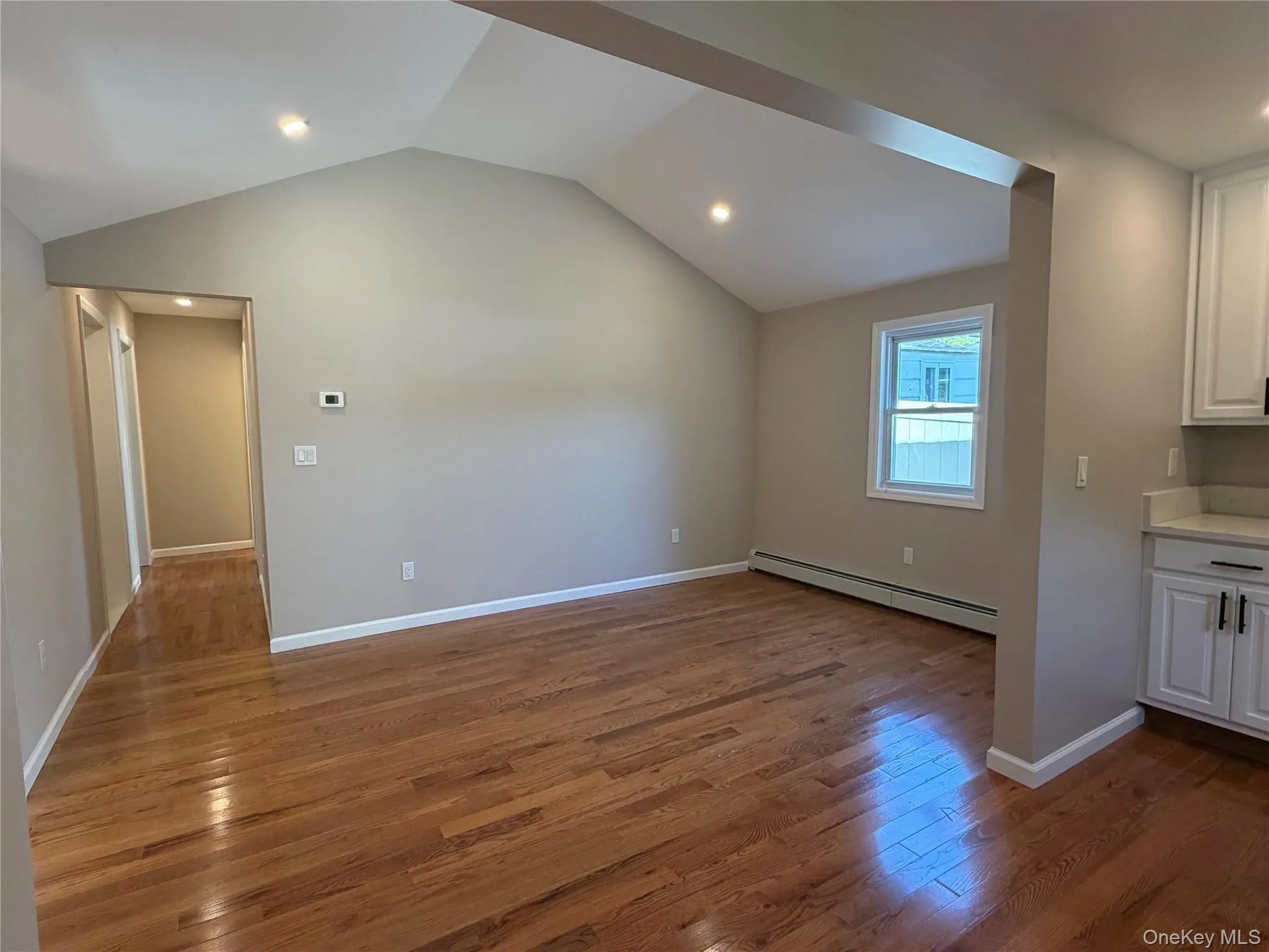Large living room dining room. There are new hardwood floors throughout cottage Large living room dining room. There are new hardwood floors throughout cottage