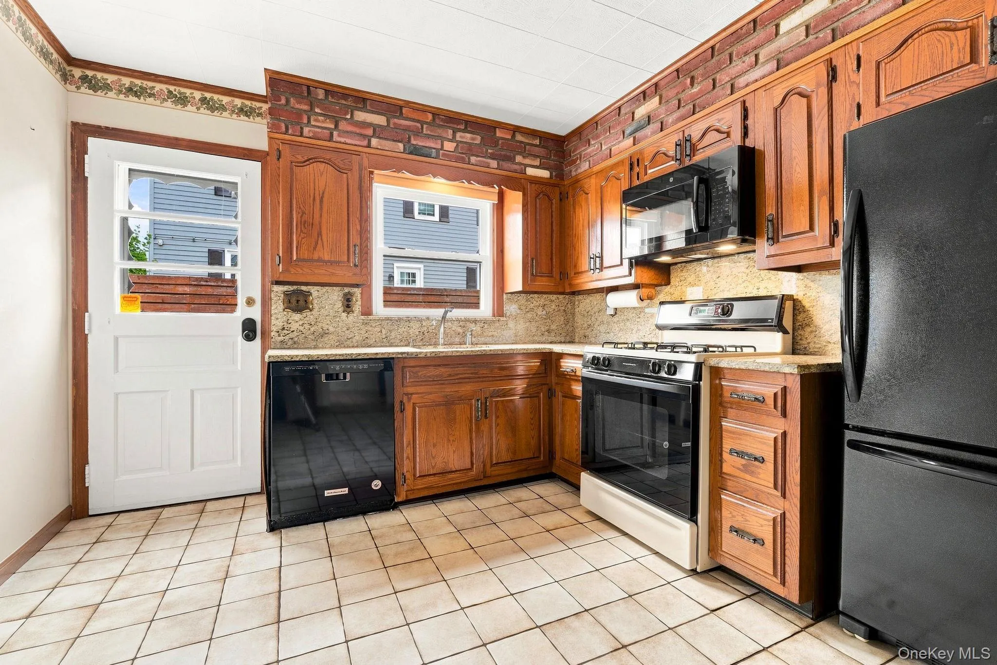 Timeless cabinetry and granite counters create a warm, inviting kitchen Timeless cabinetry and granite counters create a warm, inviting kitchen