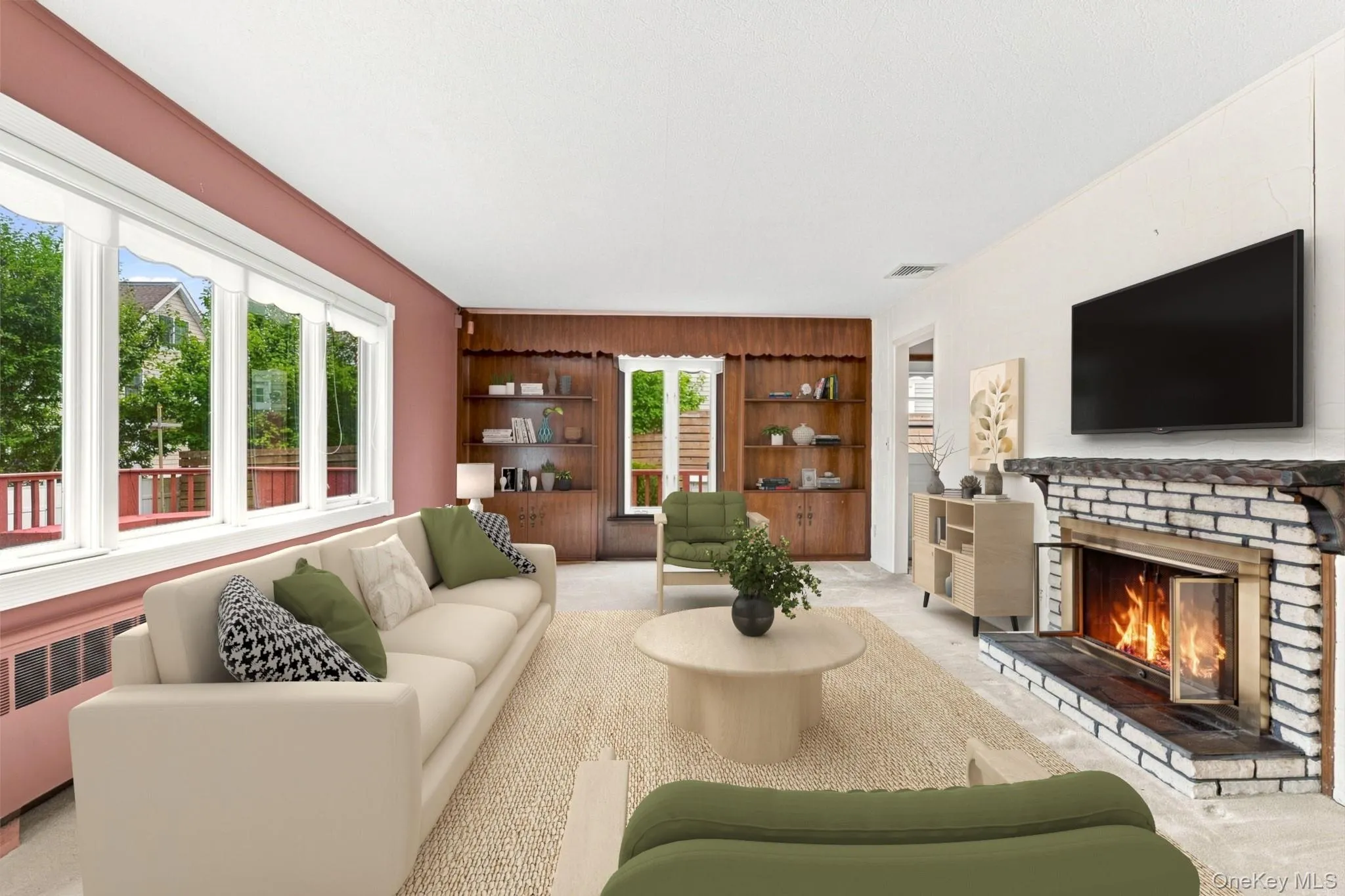 Comfortable living space with beautiful natural light and fireplace focal point Comfortable living space with beautiful natural light and fireplace focal point