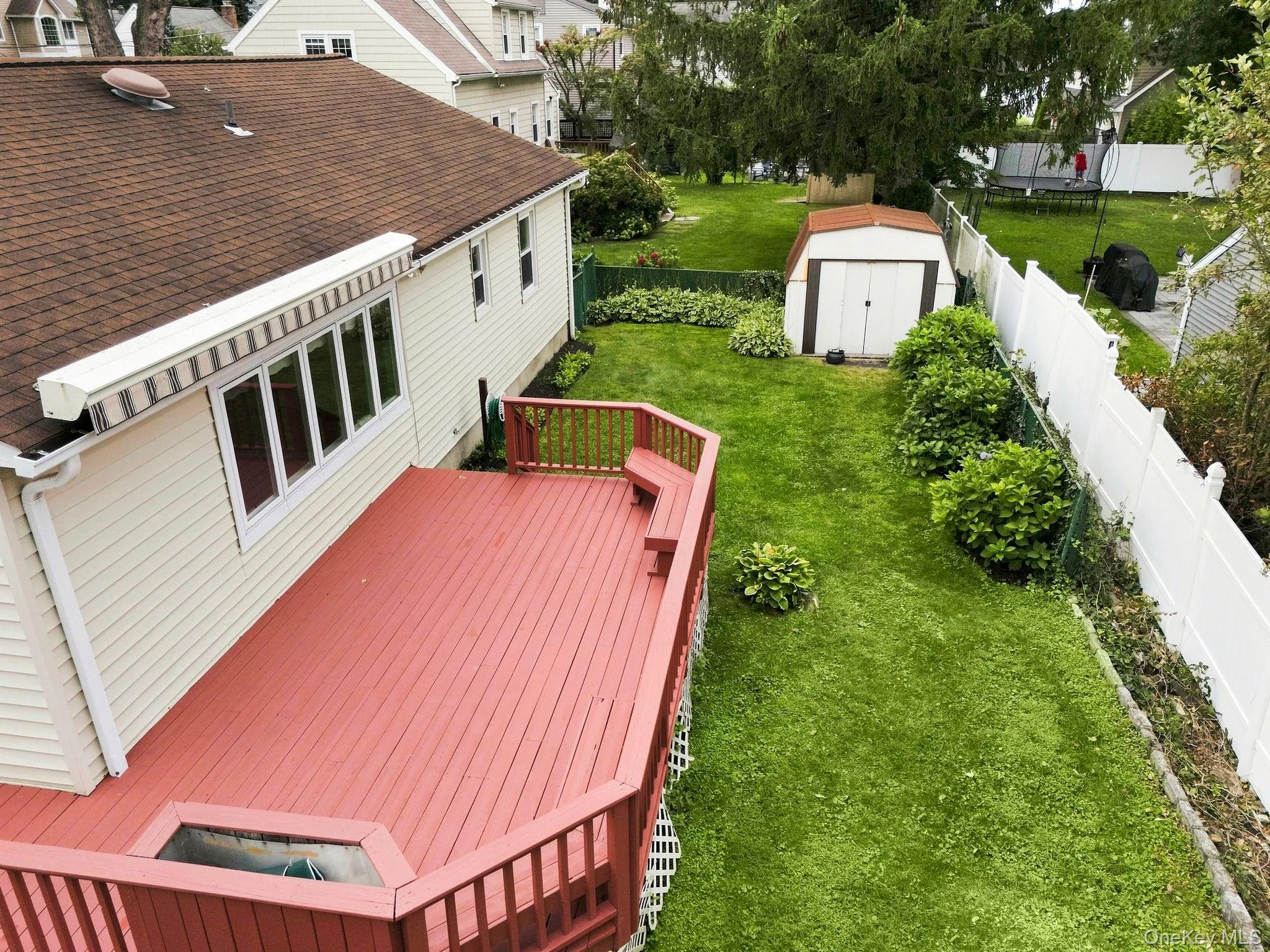 Peaceful views of the lush, private backyard from the deck Peaceful views of the lush, private backyard from the deck