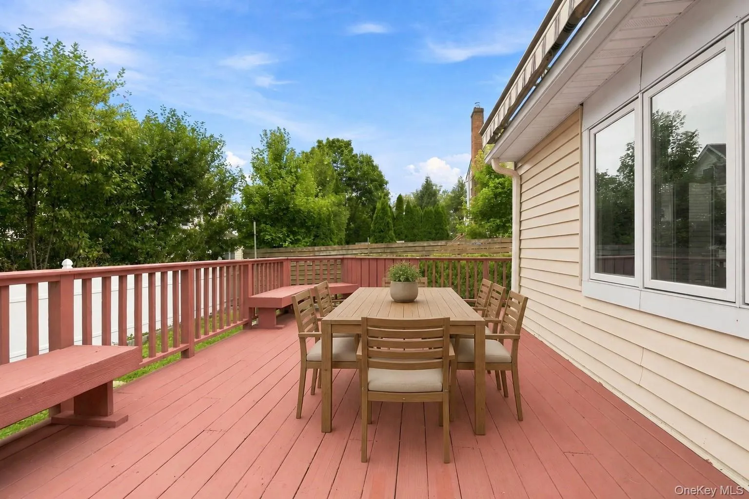 Spacious deck with a large retractable awning for shade and outdoor enjoyment Spacious deck with a large retractable awning for shade and outdoor enjoyment