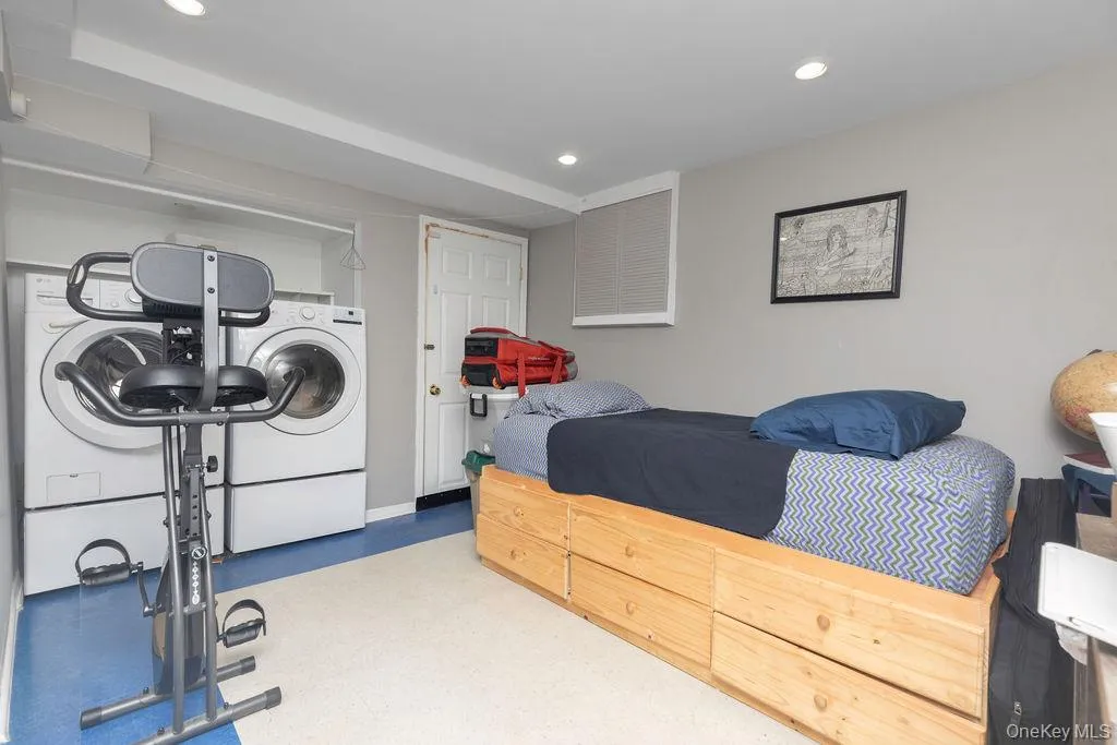 Lower Level- REC Room/ Laundry Area Lower Level- REC Room/ Laundry Area