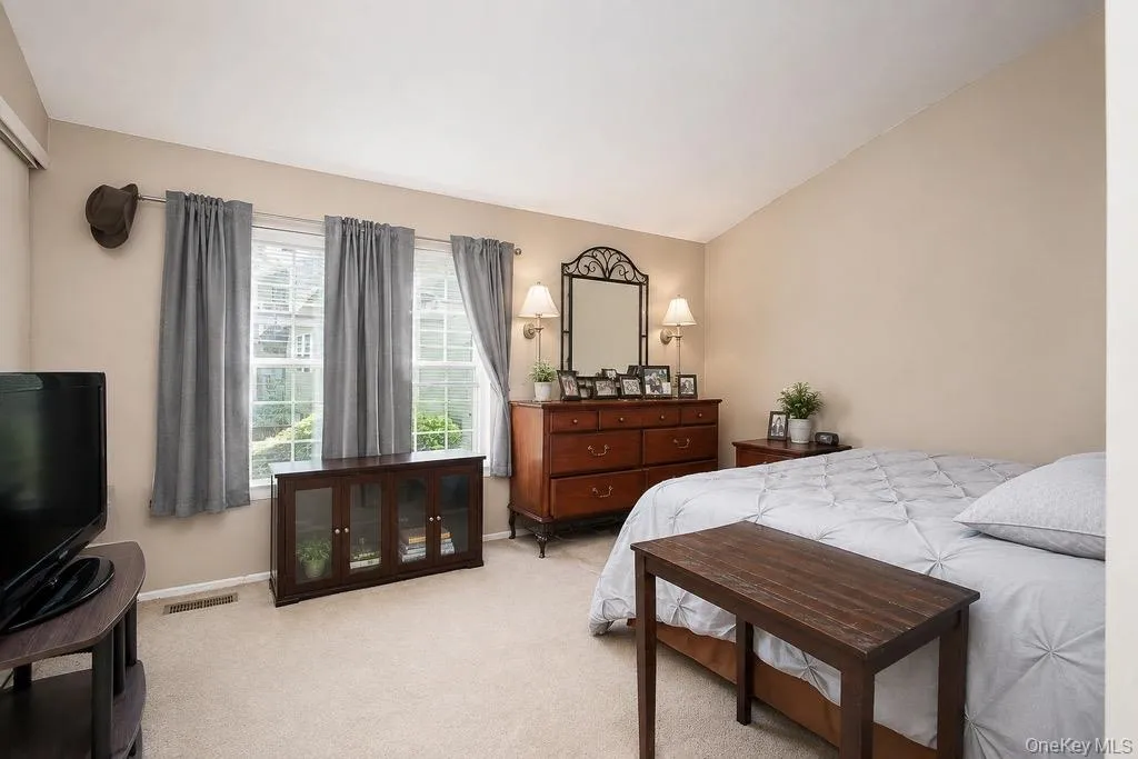 Vaulted ceiling over neutral-toned walls Vaulted ceiling over neutral-toned walls