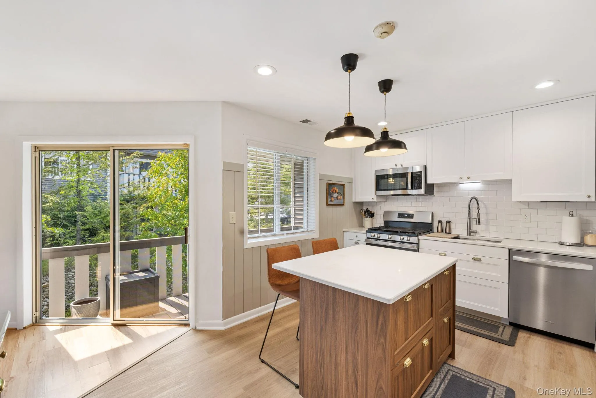 The sliding glass doors lead from the kitchen onto your private balcony. The sliding glass doors lead from the kitchen onto your private balcony.