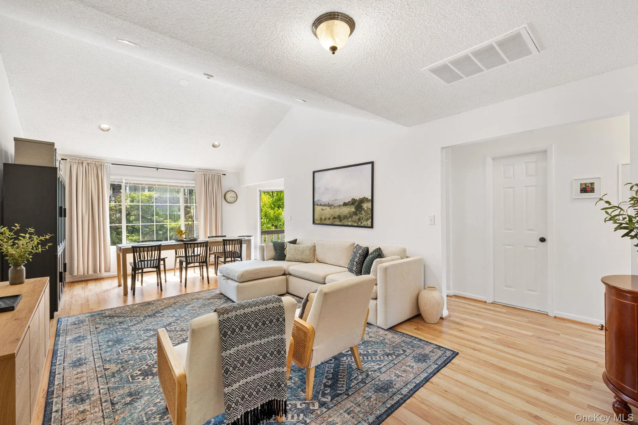 View of the living area and entrance into the hallway. View of the living area and entrance into the hallway.