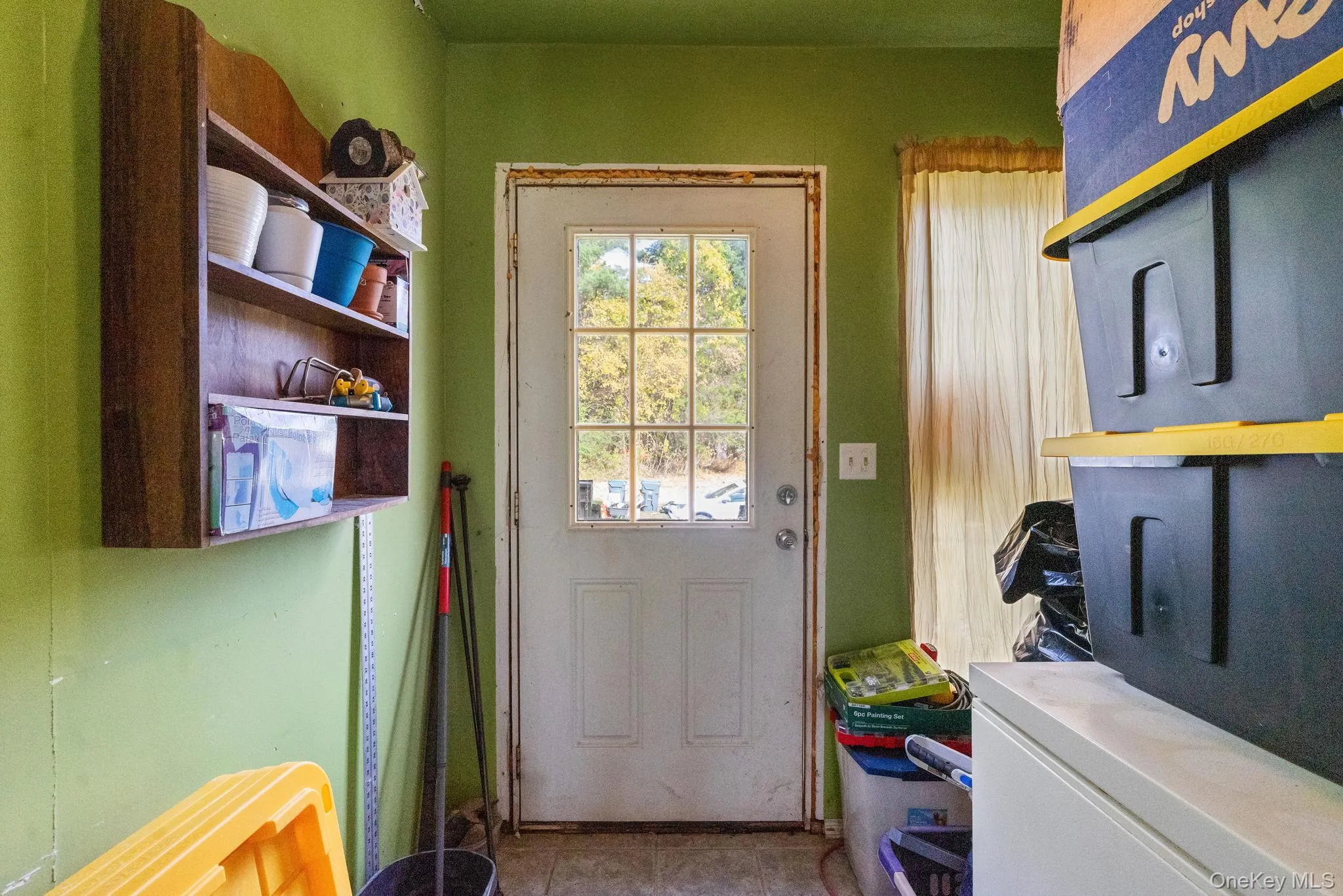 Doorway featuring tile patterned floors Doorway featuring tile patterned floors