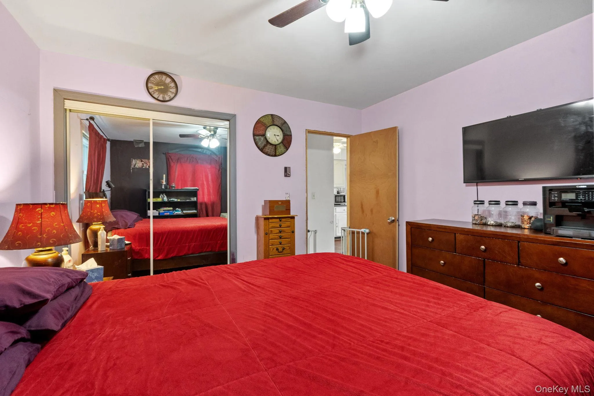 Bedroom with a closet and a ceiling fan Bedroom with a closet and a ceiling fan