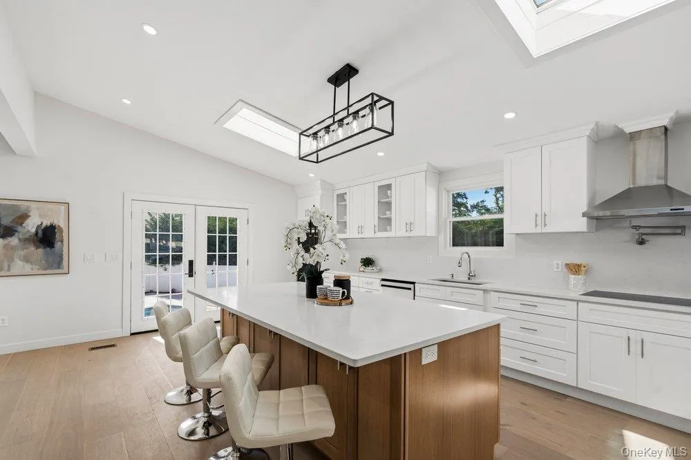 Sun Drenched Chef's Kitchen features a center island Quartz counters, and recessed lighting Sun Drenched Chef's Kitchen features a center island Quartz counters, and recessed lighting