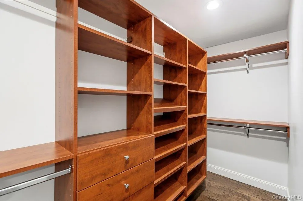One of 3 closets in Primary Suite all with closet systems One of 3 closets in Primary Suite all with closet systems