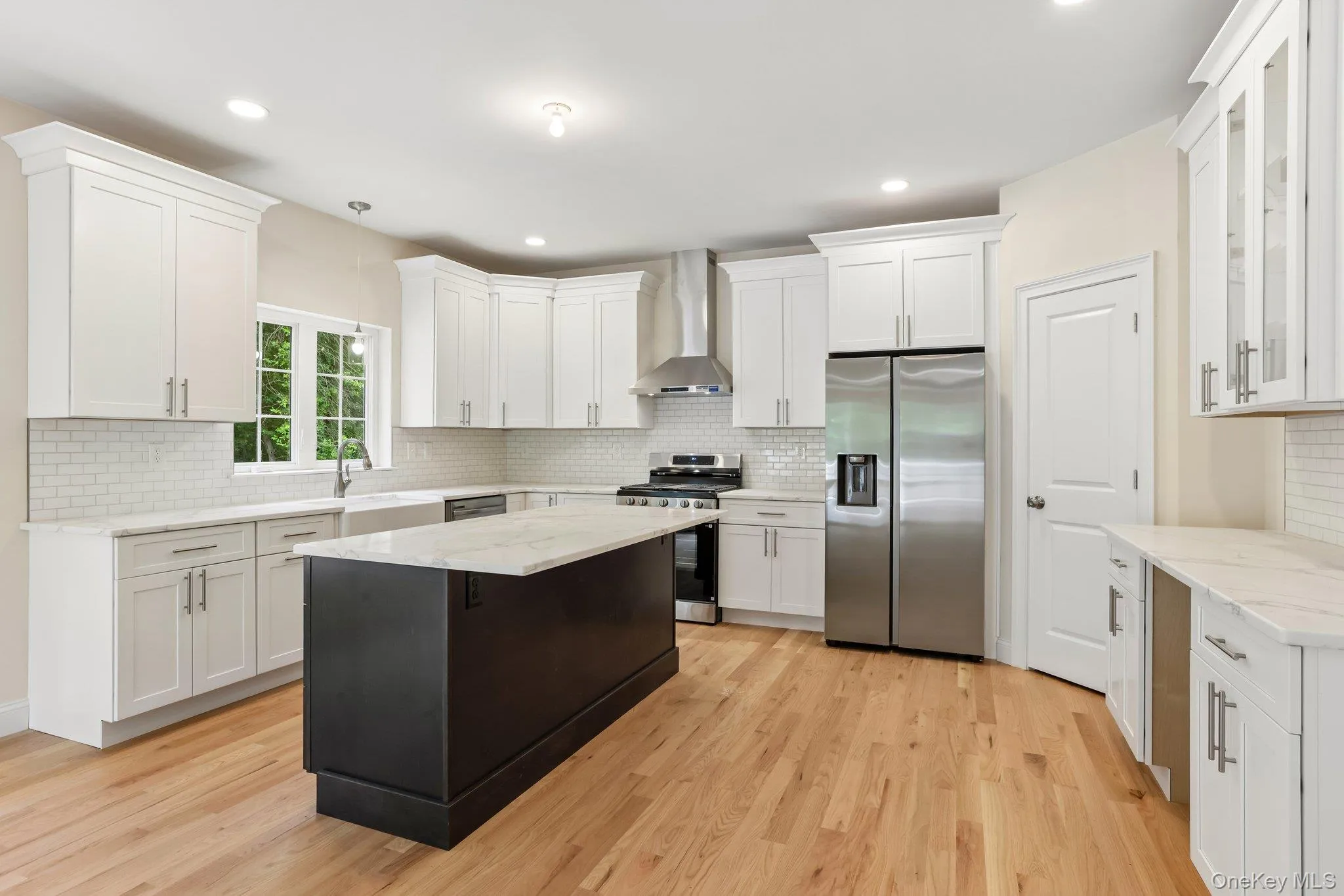 Kitchen with quartz counter tops, stainless steel appliances and large island. Kitchen with quartz counter tops, stainless steel appliances and large island.