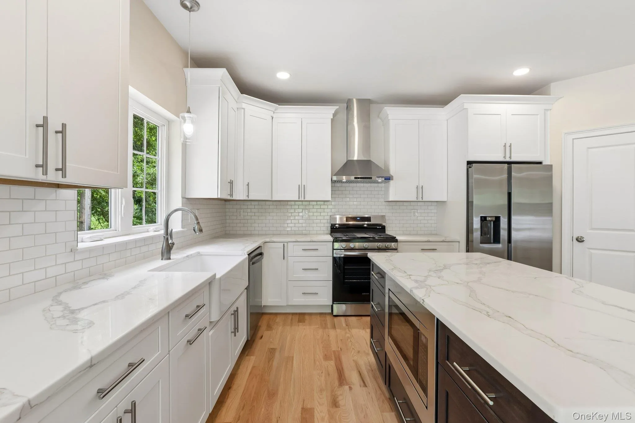 Kitchen with stainless steel appliances and large island. Kitchen with stainless steel appliances and large island.