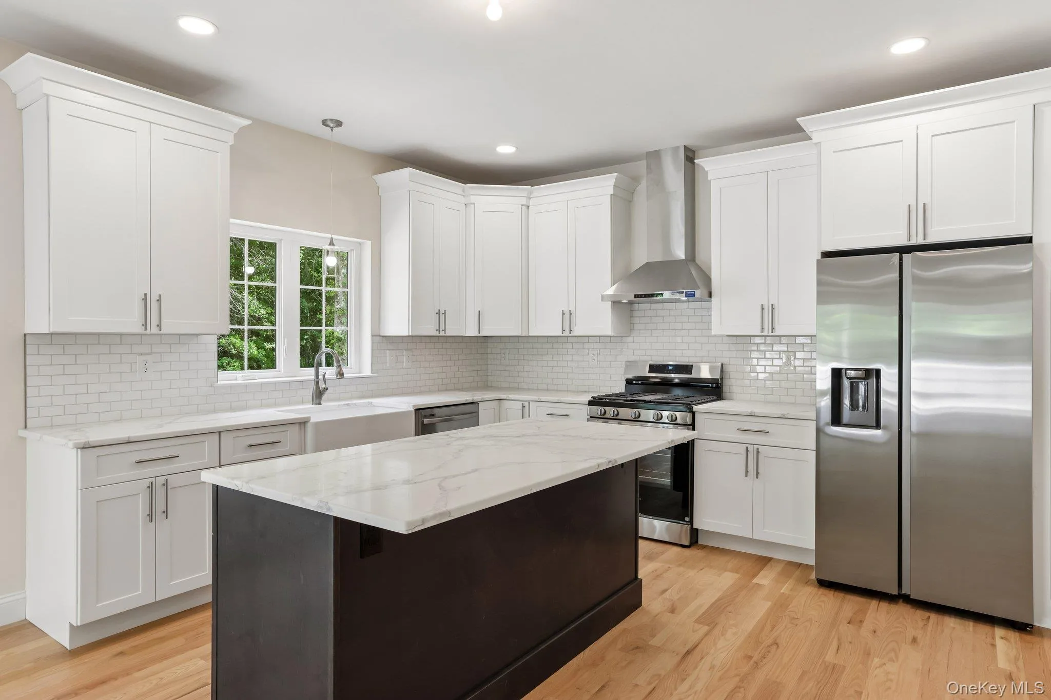 Kitchen with stainless steel appliances and large island. Kitchen with stainless steel appliances and large island.