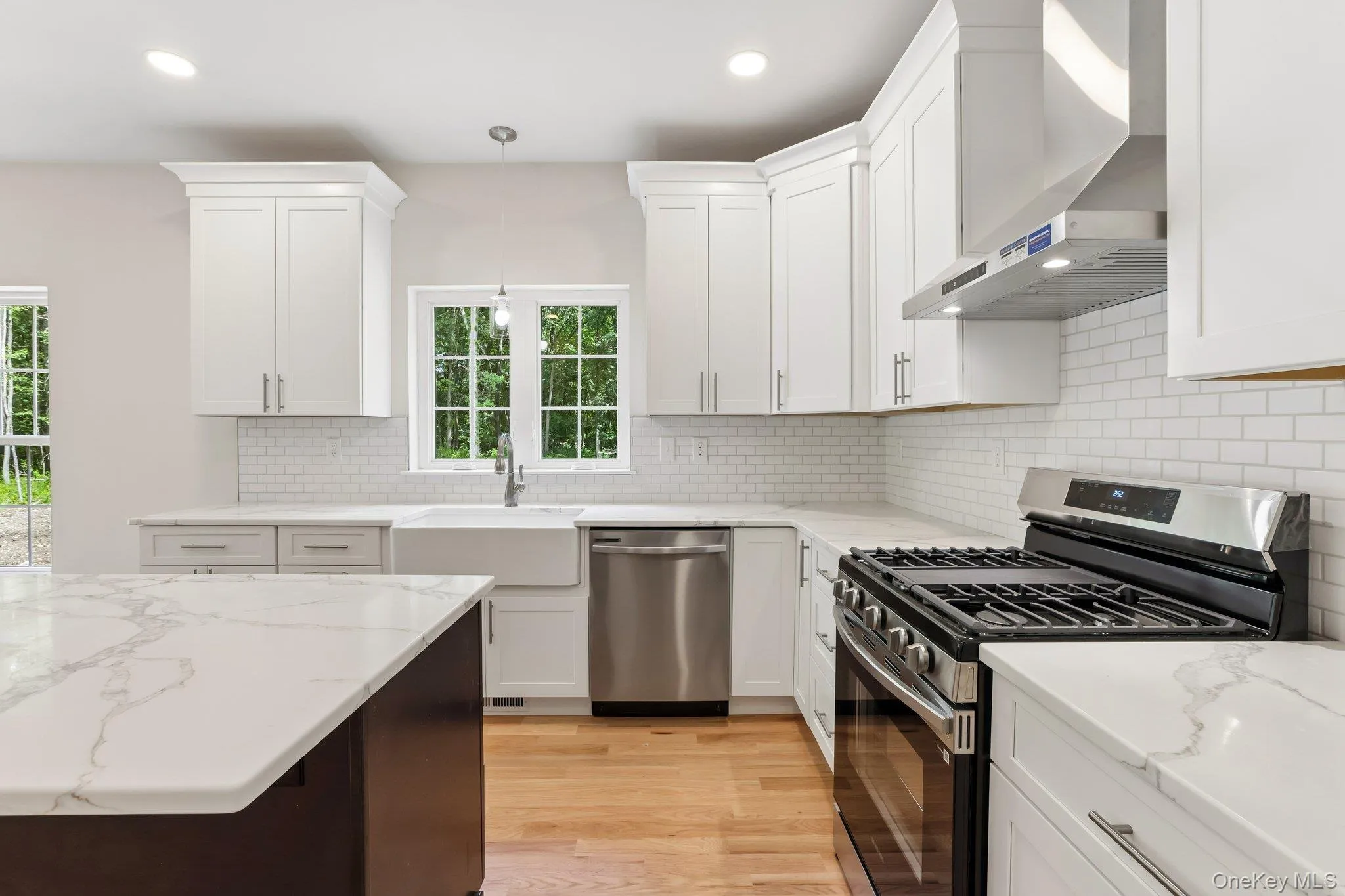 Kitchen with stainless steel appliances and large island. Kitchen with stainless steel appliances and large island.