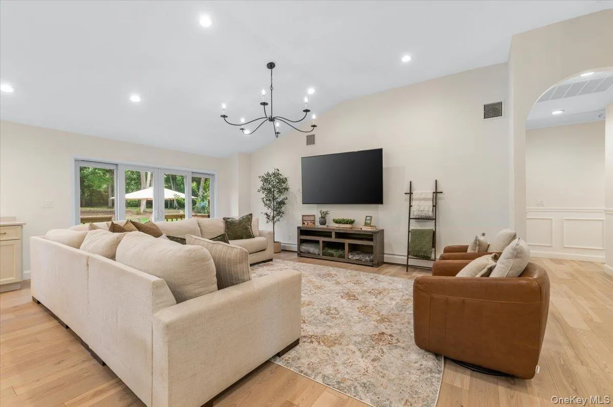 Vaulted ceiling with recessed lighting and a contemporary chandelier Vaulted ceiling with recessed lighting and a contemporary chandelier