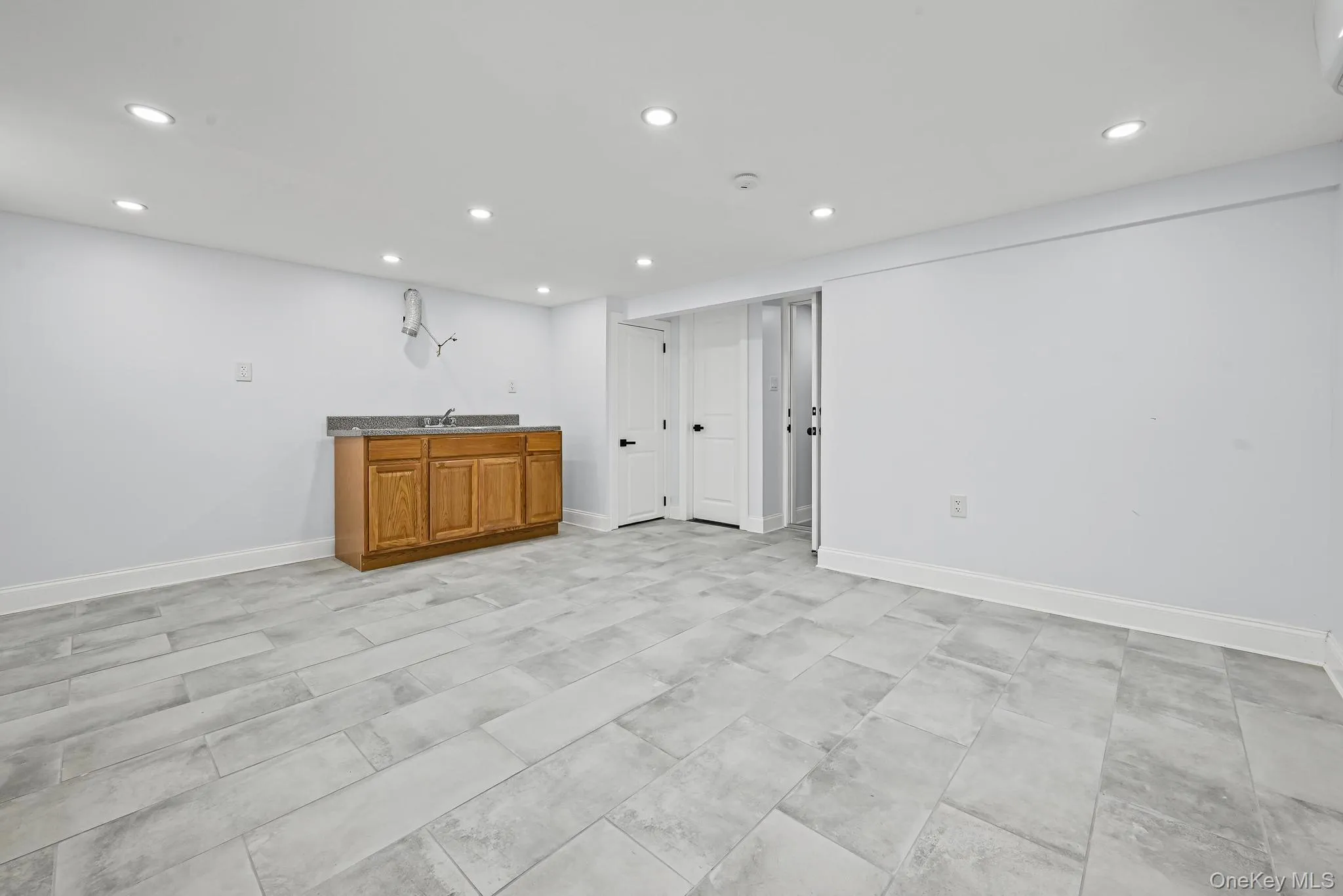 Finished basement featuring recessed lighting and baseboards Finished basement featuring recessed lighting and baseboards