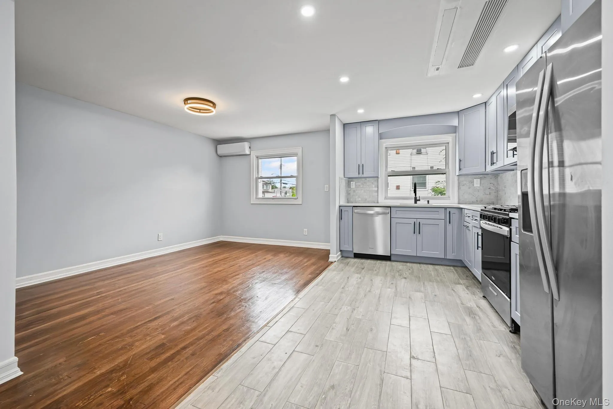 Kitchen with appliances with stainless steel finishes, light wood finished floors, healthy amount of natural light, tasteful backsplash, and recessed lighting Kitchen with appliances with stainless steel finishes, light wood finished floors, healthy amount of natural light, tasteful backsplash, and recessed lighting