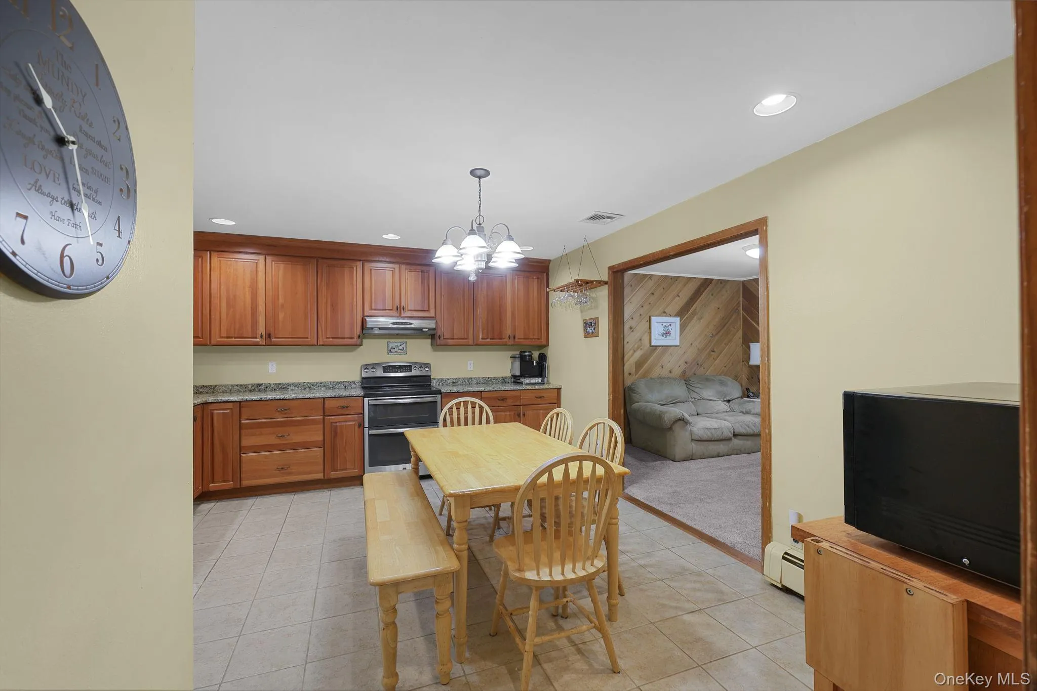 Kitchen with Recessed Lighting, Chandelier and subtle Tile Floor Kitchen with Recessed Lighting, Chandelier and subtle Tile Floor