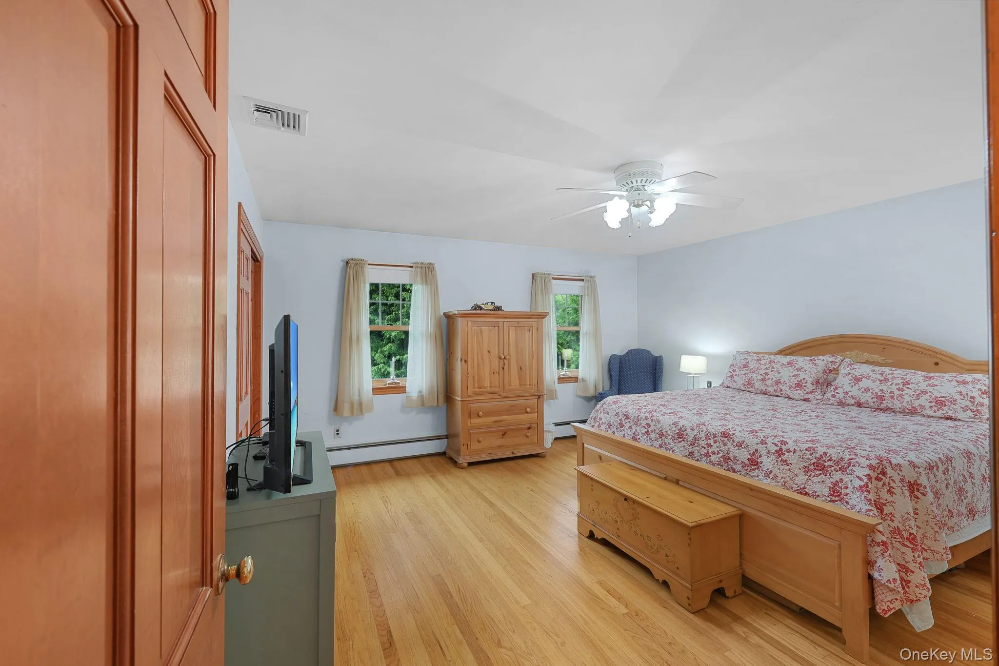 Upstairs Spacious Primary Bedroom with Hardwood Floors, Double Closets and Ceiling Fan , Space for Dressing / Nursery Upstairs Spacious Primary Bedroom with Hardwood Floors, Double Closets and Ceiling Fan , Space for Dressing / Nursery