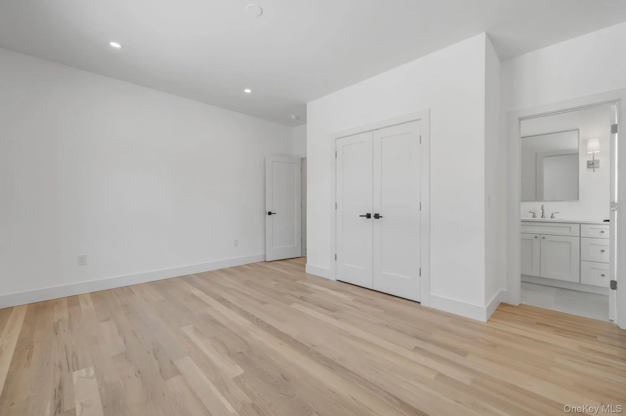 Private first floor junior primary bedroom with a full bath, ideal for guests, or a flexible office setup. Private first floor junior primary bedroom with a full bath, ideal for guests, or a flexible office setup.