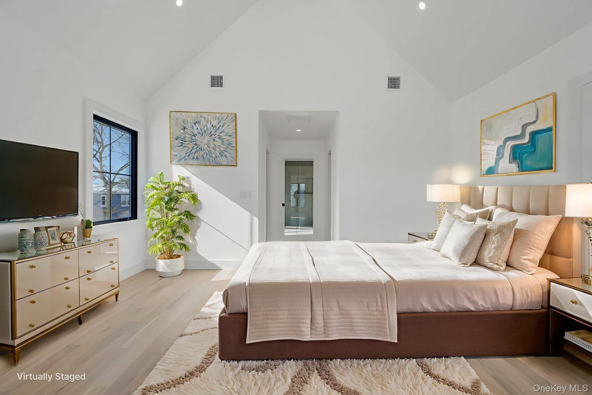 Spacious retreat with vaulted ceilings and large windows, dual walk in closets and primary bath. Virtually Staged. Spacious retreat with vaulted ceilings and large windows, dual walk in closets and primary bath. Virtually Staged.