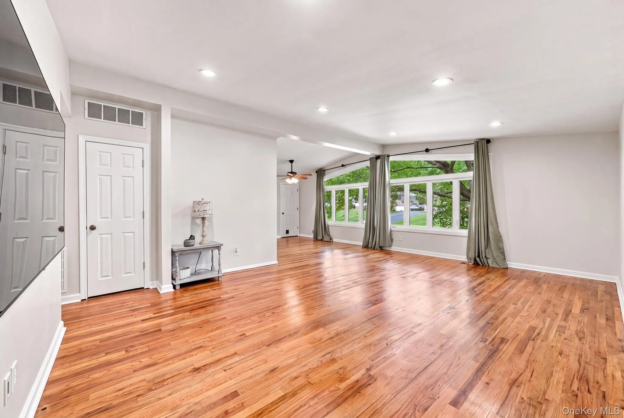 Hardwood flooring, recessed lighting and expansive windows Hardwood flooring, recessed lighting and expansive windows