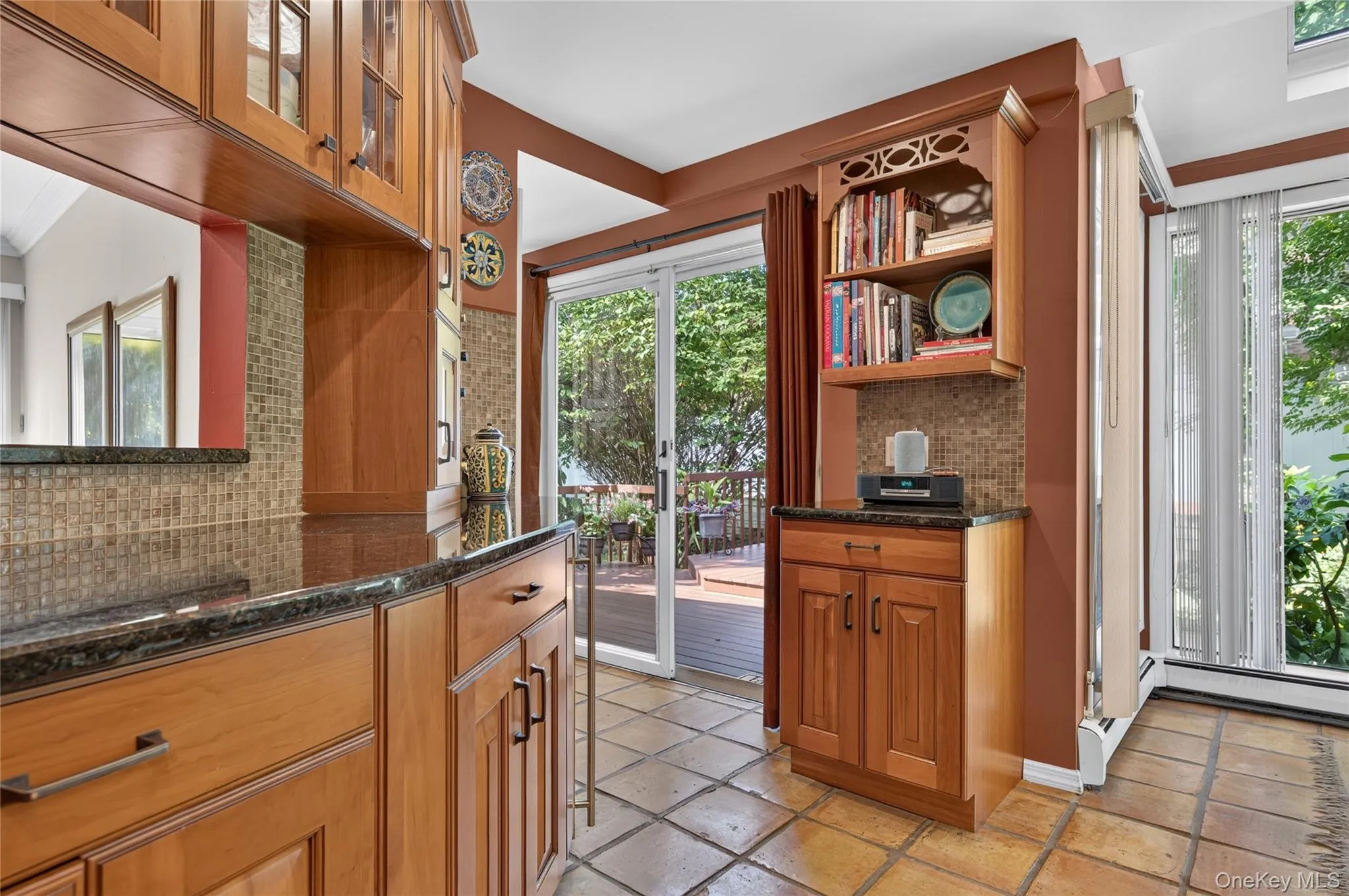 Wrap around kitchen with two sliders to the deck, built-in wine refrigerator Wrap around kitchen with two sliders to the deck, built-in wine refrigerator