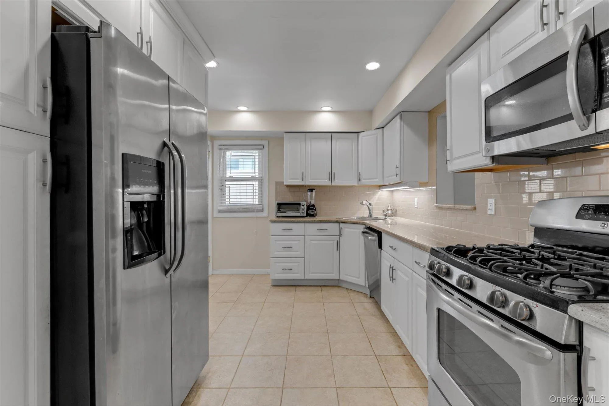 Kitchen with granite countertops and stainless steel appliances Kitchen with granite countertops and stainless steel appliances